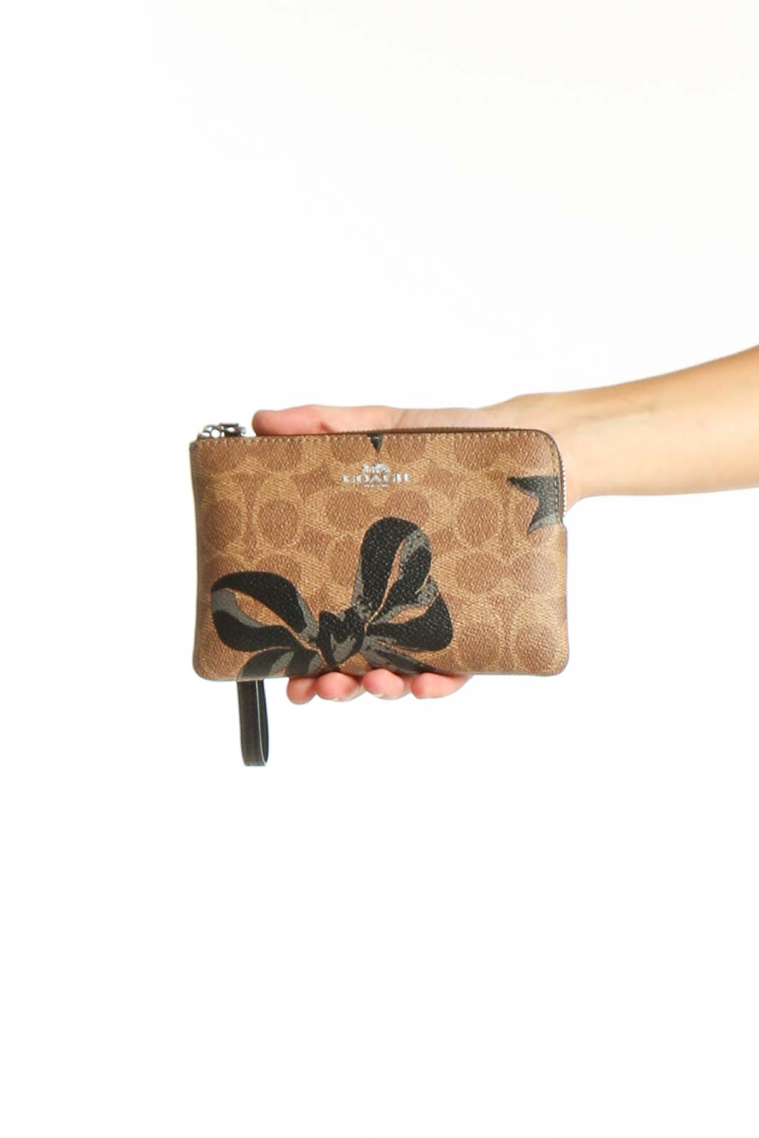 Brown Signature Canvas Wristlet with Bow Print Front